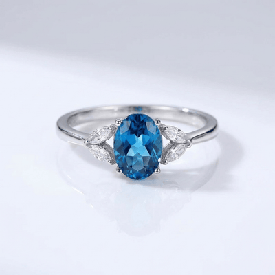 SILVER BLUE TOPAZ OVAL RING - (ADJUSTABLE)