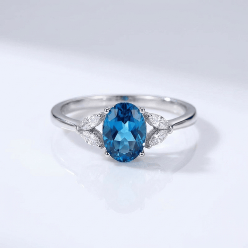 SILVER BLUE TOPAZ OVAL RING - (ADJUSTABLE)