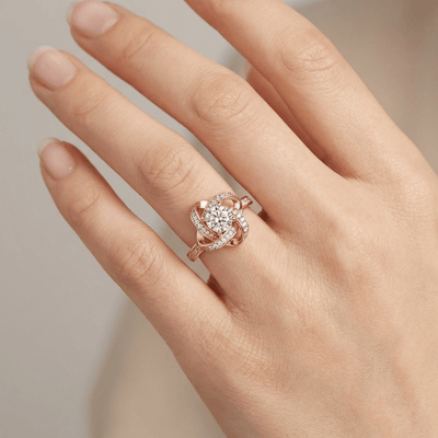 ROSE GOLD ZIRCONIA TWISTED KNOT RING - (ADJUSTABLE)